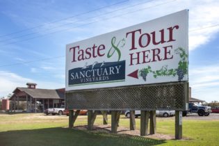 sanctuary vineyards wine tour sign